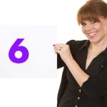 Call answering service lady holding up number 6
